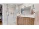 Bathroom featuring a glass shower and vanity at 10667 E Goose Haven Dr, Lafayette, CO 80026