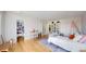 Well-lit bedroom with desk, shelving, and walk-in closet at 10667 E Goose Haven Dr, Lafayette, CO 80026