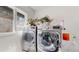 Bright laundry room with plants at 10667 E Goose Haven Dr, Lafayette, CO 80026