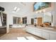 Well-lit bathroom with soaking tub, skylight, and double vanity sink at 4520 Forest Hill Rd, Evergreen, CO 80439