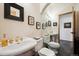 Bathroom with dual sinks, marble floors and a large mirror at 4520 Forest Hill Rd, Evergreen, CO 80439