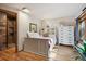 Cozy bedroom with hardwood floors and a well-lit shower at 4520 Forest Hill Rd, Evergreen, CO 80439