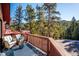 Relax on this spacious deck with great views and comfortable outdoor seating at 4520 Forest Hill Rd, Evergreen, CO 80439