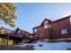 Exterior of home featuring large windows and a spacious deck at 4520 Forest Hill Rd, Evergreen, CO 80439