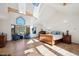 Primary bedroom with hardwood floors, view-framing windows, and stylish decor at 4520 Forest Hill Rd, Evergreen, CO 80439