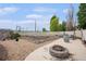 Backyard space featuring a fire pit, garden beds, and swing set, perfect for outdoor enjoyment at 9650 Raven St, Firestone, CO 80504