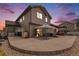 A spacious backyard patio features a covered seating area, perfect for outdoor relaxation at 9650 Raven St, Firestone, CO 80504