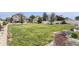 Lush backyard featuring a large lawn, mature trees, and a well-maintained garden at 9650 Raven St, Firestone, CO 80504