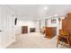 Spacious carpeted basement with ample space, featuring a bar and furniture at 9650 Raven St, Firestone, CO 80504