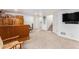 Spacious carpeted basement featuring a bar and furniture at 9650 Raven St, Firestone, CO 80504