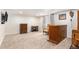 Spacious carpeted basement featuring a bar and furniture at 9650 Raven St, Firestone, CO 80504