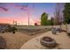 Outdoor fire pit area with seating, garden beds and gravel landscaping at 9650 Raven St, Firestone, CO 80504