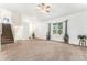 Bright living room with large window and neutral color scheme at 9650 Raven St, Firestone, CO 80504