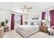 Charming main bedroom with neutral carpet, accent curtains, natural light, and stylish furnishings at 9650 Raven St, Firestone, CO 80504