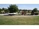 Community playground with various play structures, surrounded by lush greenery, offers a fun space at 9650 Raven St, Firestone, CO 80504