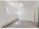 Cozy bedroom with carpet flooring, natural light from two windows, and neutral colored walls at 1265 Colorado Blvd # 12, Denver, CO 80206