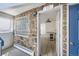 Inviting entryway with stone accent wall, modern lighting, and a glimpse into the interior with stylish flooring at 1265 Colorado Blvd # 12, Denver, CO 80206