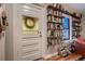 Charming entryway featuring a decorative glass door and built-in shelving for books at 1181 S Clarkson St, Denver, CO 80210