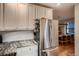 Modern kitchen with granite countertops, stainless steel appliances, and ample cabinet space at 1181 S Clarkson St, Denver, CO 80210