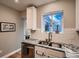 Modern kitchen with granite countertops, stainless steel appliances, and a bright window view at 1181 S Clarkson St, Denver, CO 80210