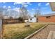 Back yard features a storage shed, mature trees, and large space at 6270 Harlan St, Arvada, CO 80003