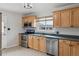 Modern kitchen with stainless steel appliances and updated countertops at 6270 Harlan St, Arvada, CO 80003