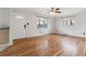 Bright and airy living room showcasing beautiful hardwood floors and ample natural light at 6270 Harlan St, Arvada, CO 80003