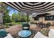 Entertainer's backyard featuring brick patio, multiple seating areas, and ping pong table at 3145 W 31St Ave, Denver, CO 80211