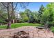 Landscaped backyard features a stone patio and fire pit perfect for relaxing outdoors and entertaining at 3145 W 31St Ave, Denver, CO 80211