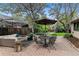Beautiful brick patio with multiple seating areas, covered seating, and lush landscaping at 3145 W 31St Ave, Denver, CO 80211