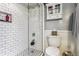 Updated bathroom featuring tiled shower with glass door and mosaic floor at 3145 W 31St Ave, Denver, CO 80211
