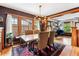 Dining room featuring hardwood floors, a unique chandelier, and natural light at 3145 W 31St Ave, Denver, CO 80211