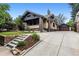 Charming brick home with landscaped front yard, long driveway, and detached garage at 3145 W 31St Ave, Denver, CO 80211