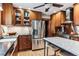 Well-appointed kitchen featuring stainless steel appliances, wooden cabinets, and a marble-top island at 3145 W 31St Ave, Denver, CO 80211