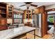 Stylish kitchen with custom wood cabinets, granite counters, and stainless steel appliances at 3145 W 31St Ave, Denver, CO 80211