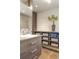 Bathroom with a large mirror, spacious vanity and storage, and decorative plant at 3401 E Kentucky Ave, Denver, CO 80209