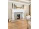 Dining area featuring a white fireplace with decorative mantle and nearby seating at 3401 E Kentucky Ave, Denver, CO 80209