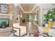 Bright living room featuring a stone fireplace, recessed lighting, and neutral decor at 3401 E Kentucky Ave, Denver, CO 80209