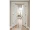 View through double doors revealing a well-lit main bedroom with hardwood floors and recessed lighting at 3401 E Kentucky Ave, Denver, CO 80209