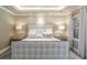Bright and airy main bedroom with plush bedding, bedside tables, and a large window at 3401 E Kentucky Ave, Denver, CO 80209