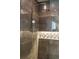Walk-in shower with sleek chrome fixtures, a rain shower head, and a decorative niche at 3401 E Kentucky Ave, Denver, CO 80209