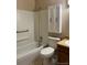 Full bathroom with tub, toilet, vanity and built-in medicine cabinet at 11318 Clermont Dr, Thornton, CO 80233