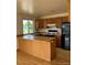Functional kitchen with wood cabinets and a breakfast bar at 11318 Clermont Dr, Thornton, CO 80233