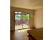 Living room featuring sliding glass doors to a balcony and chandelier at 11318 Clermont Dr, Thornton, CO 80233