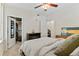 Comfortable bedroom featuring carpet floors, ceiling fan, and closet at 2640 Central Ct # 104, Denver, CO 80211