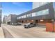 Contemporary building exterior with a gray metal facade, wood accents, and convenient parking spaces at 2640 Central Ct # 104, Denver, CO 80211