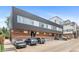 Modern building exterior featuring a combination of metal, wood, and large windows, with convenient parking at 2640 Central Ct # 104, Denver, CO 80211