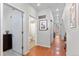 Hallway with access to a bathroom and the kitchen at 2640 Central Ct # 104, Denver, CO 80211