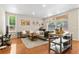 Inviting living area with hardwood floors, a comfortable sofa, and ample natural light at 2640 Central Ct # 104, Denver, CO 80211