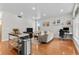 Spacious living room with hardwood floors, a cozy sofa, and a dedicated workspace at 2640 Central Ct # 104, Denver, CO 80211